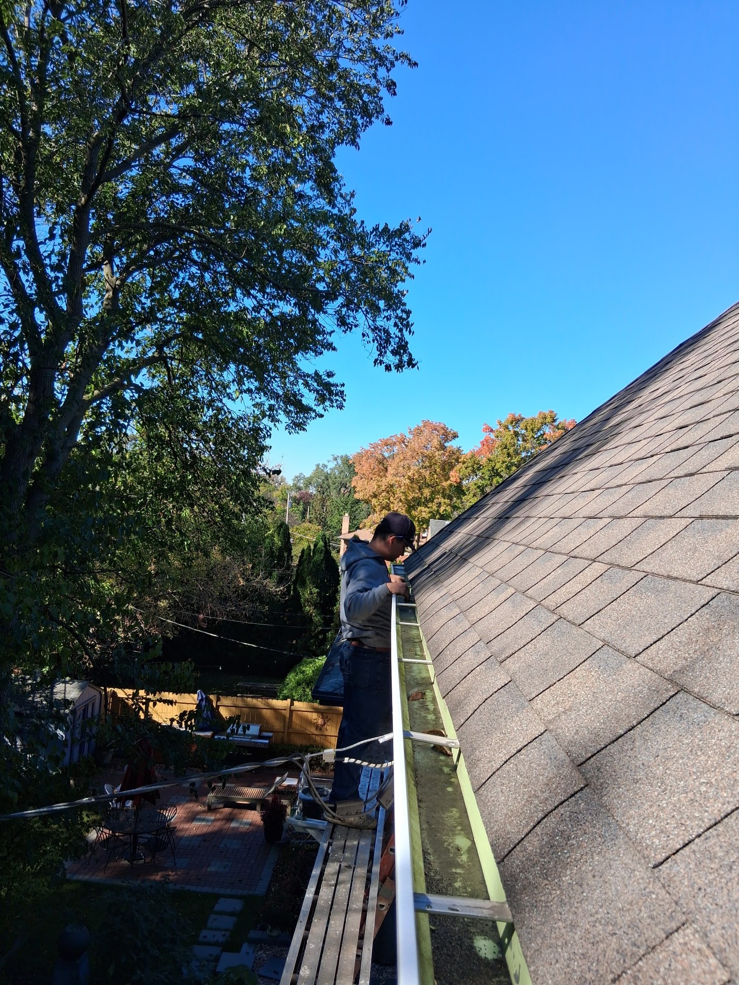 Two-story Evanston home gutters before and after gutter guards were installed (Before)