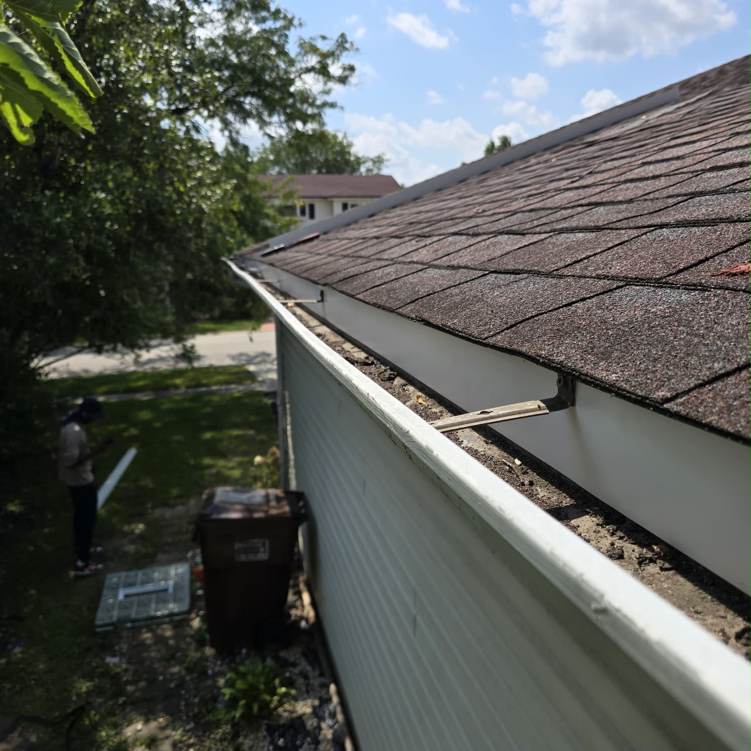 House gutter and fascia before and after the missing gutter apron was installed (After)