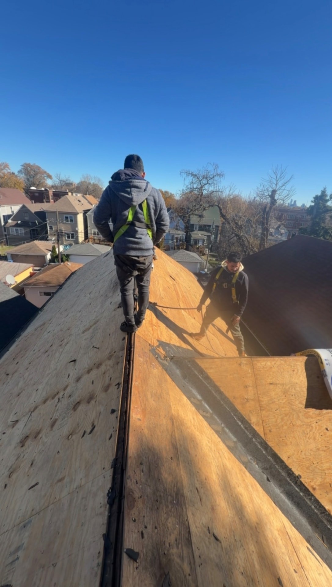 Two-story shingle roof in Logan Square before and after a full replacement (Before)